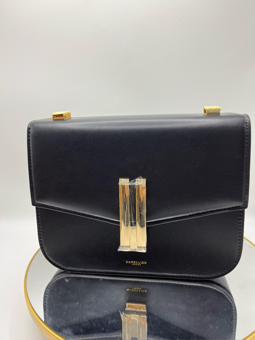DeMellier Black Leather Gold‑Clasp Flap Crossbody Bag